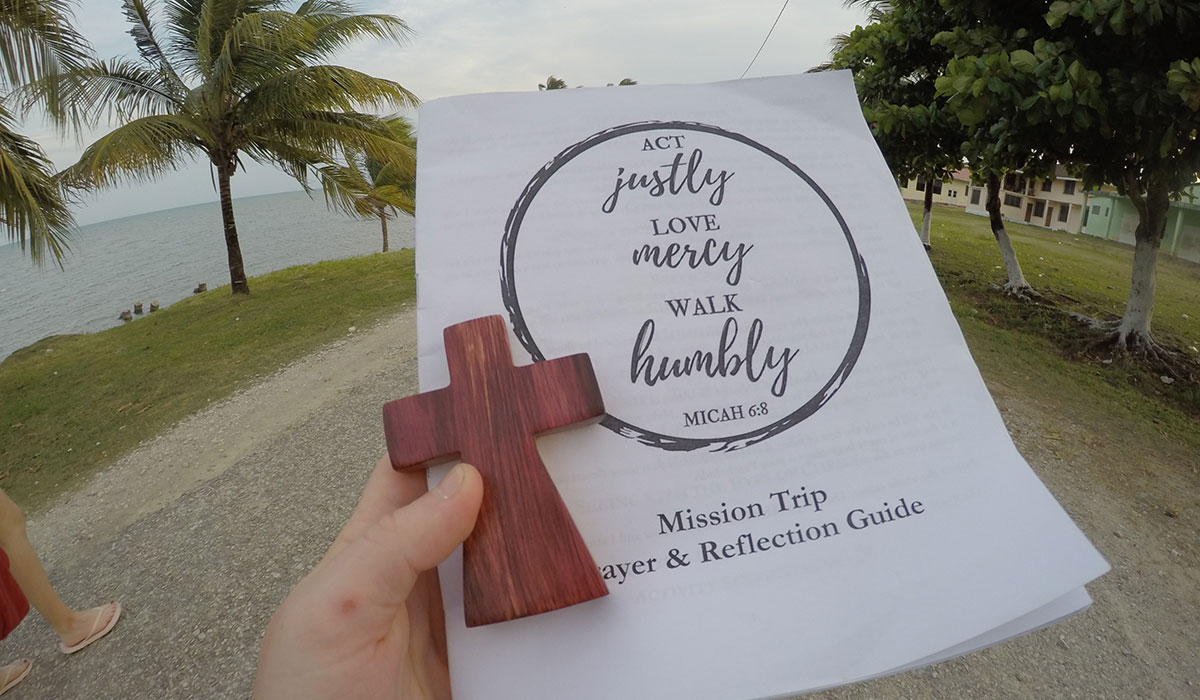 Students use a  prayer and reflection guide in Punta Gorda.