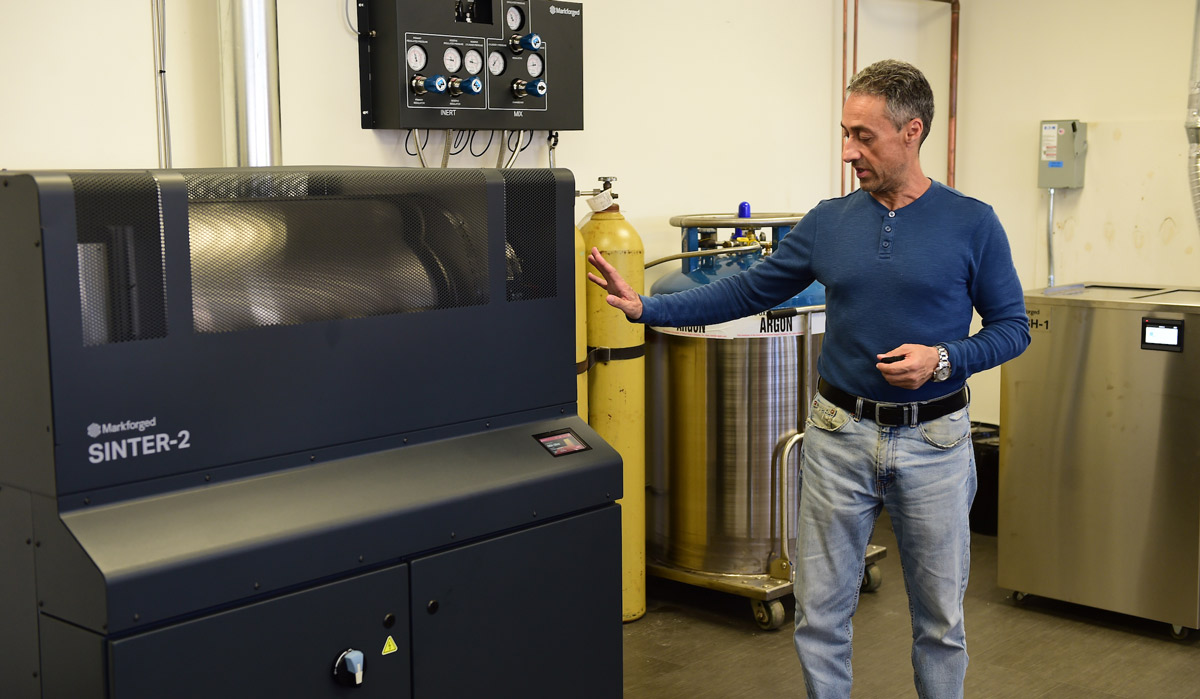 Professor showing new 3-D printer
