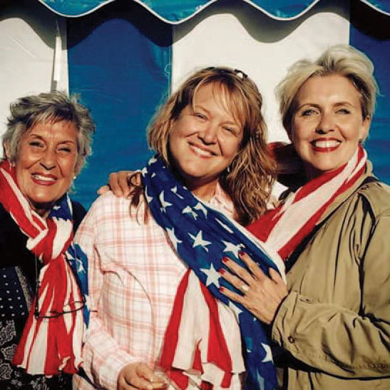 Three women with an American flag dress