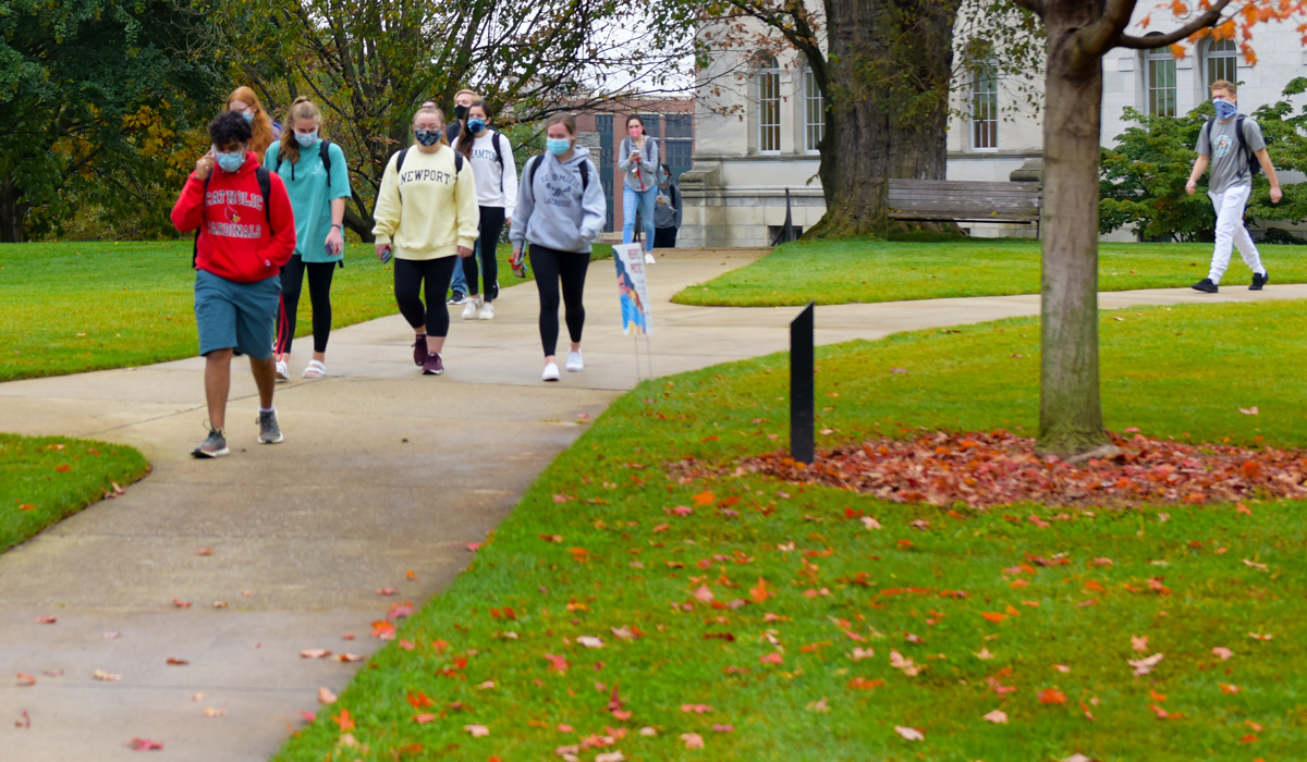 Students walking on campus sidewalks