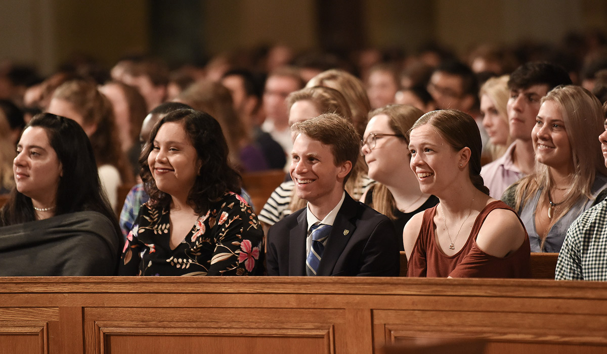 Students listening to convocation speakers inside the Basilica of the National Shrine of the Immaculate Conception