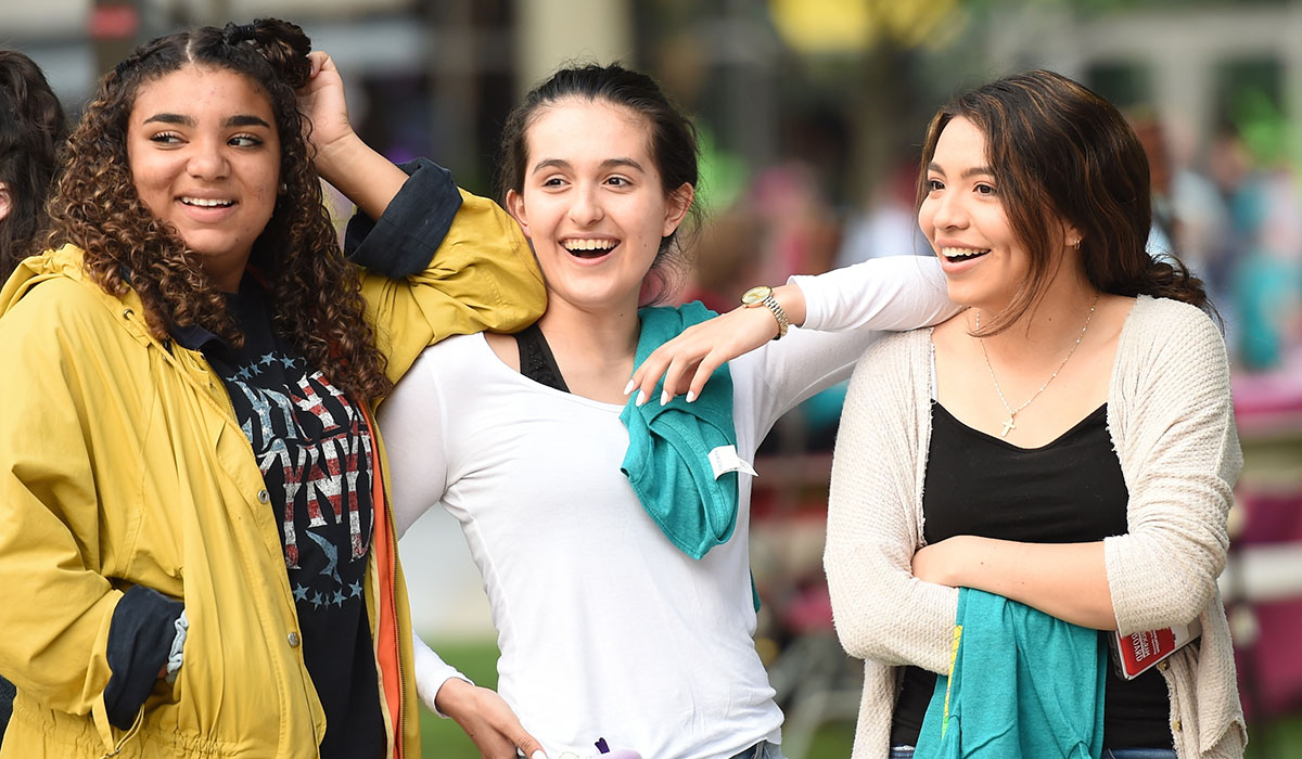Female students smiling at Luaupalooza