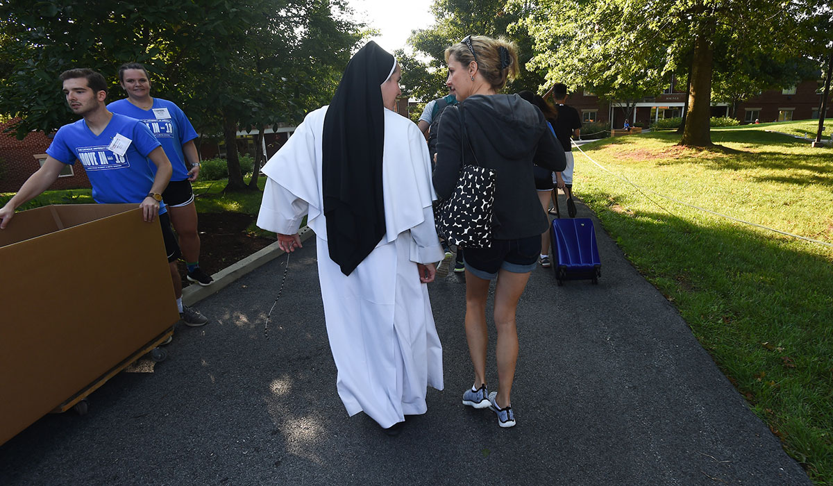 Nun talking to mother