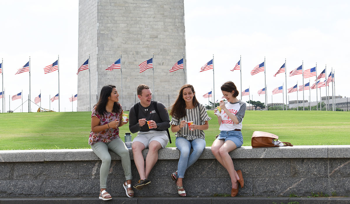 Students eating ice cream in front of Washington Monument