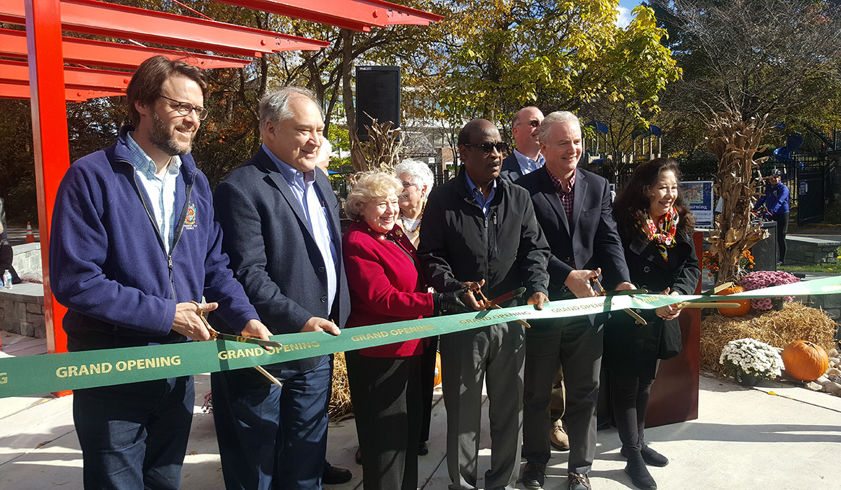 The Neal Potter Plaza grand opening ribbon being cut