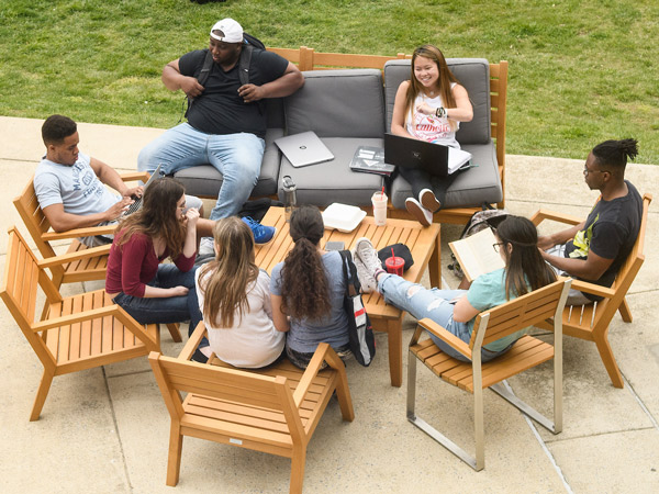 Students relax on the Pryz patio