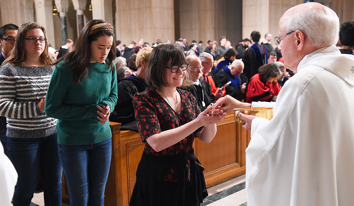 Student receives Communion 