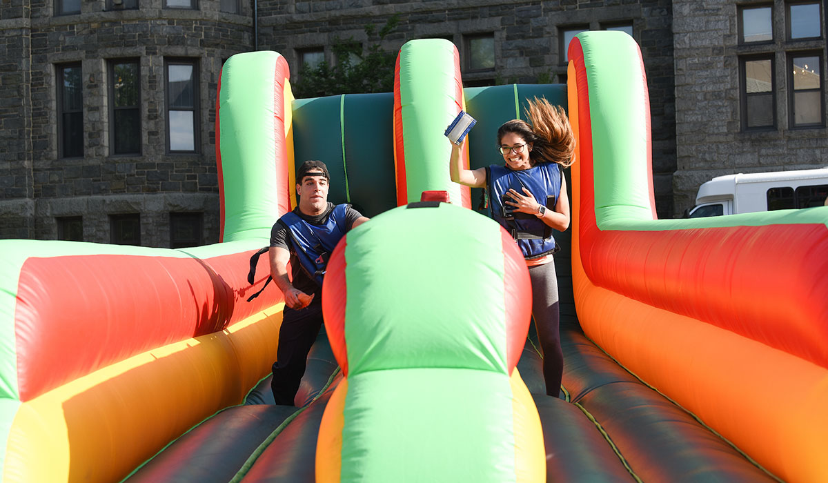 Students playing inflatable racing game