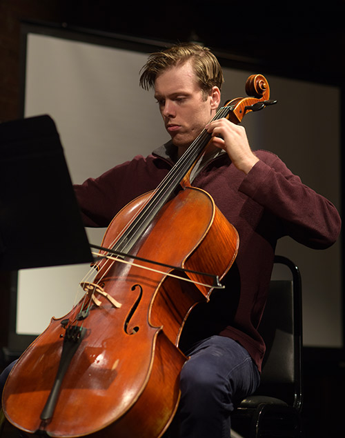 student playing the cello