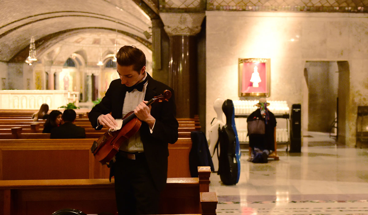 Male musician getting ready in Crypt Church
