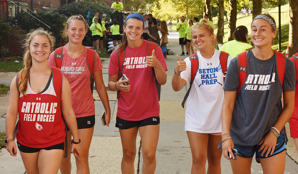 Students from the women field hockey outside on movein day