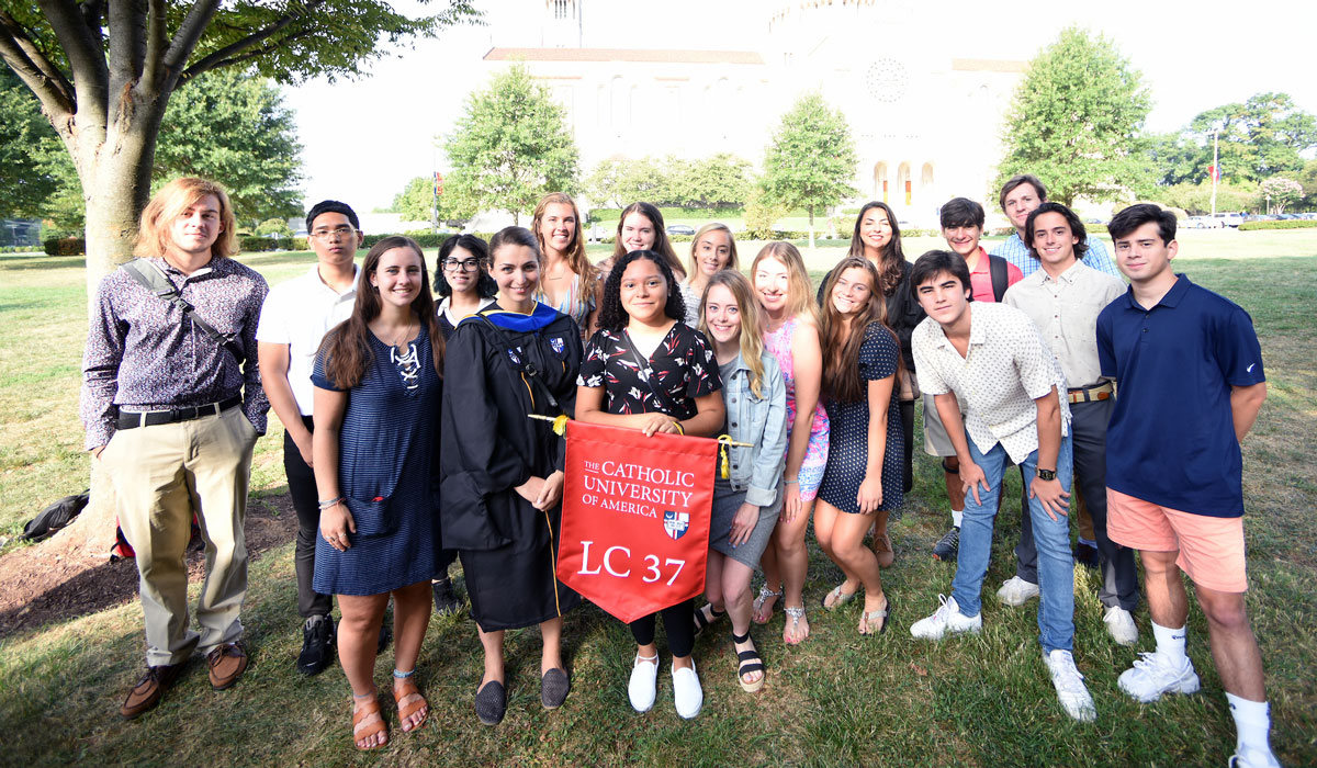 Students from a learning community pose for a group photo before convocation