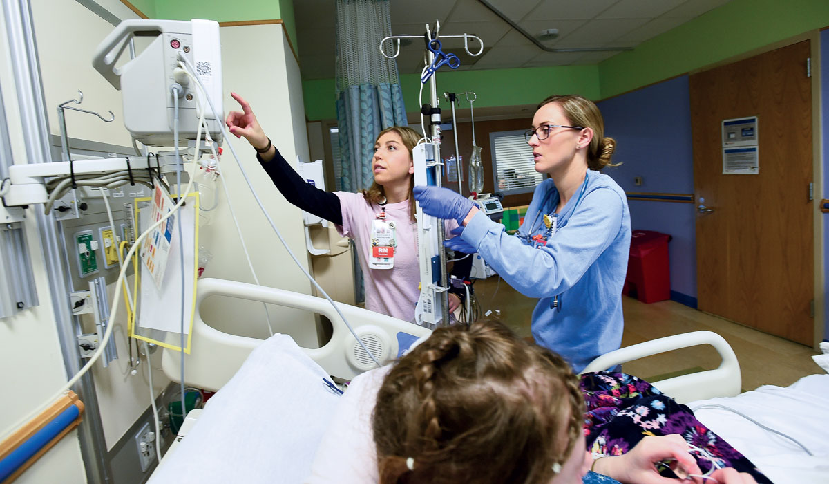 Graceann Kraemer and Sadie Rendon treat a patient at Children's National Health System.