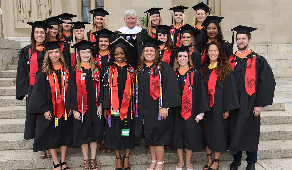 Bill Conway with nursing students at Commencement