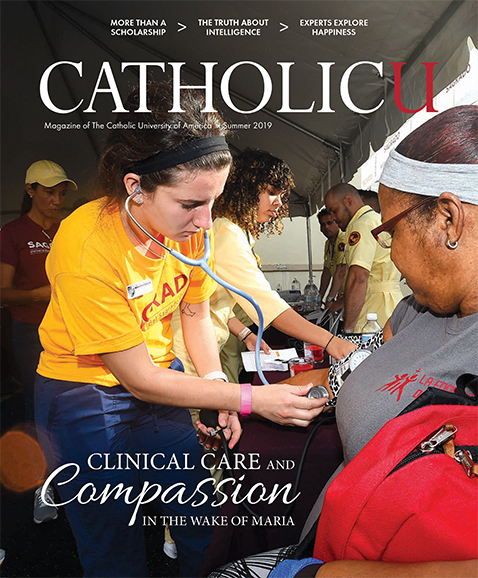 Cover of CatholicU magazine featuring a nurse providing care to a woman in Puerto Rico