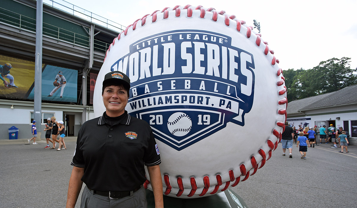 Kelly Dine standing for a photo at the 2019 Little League Baseball World Series.