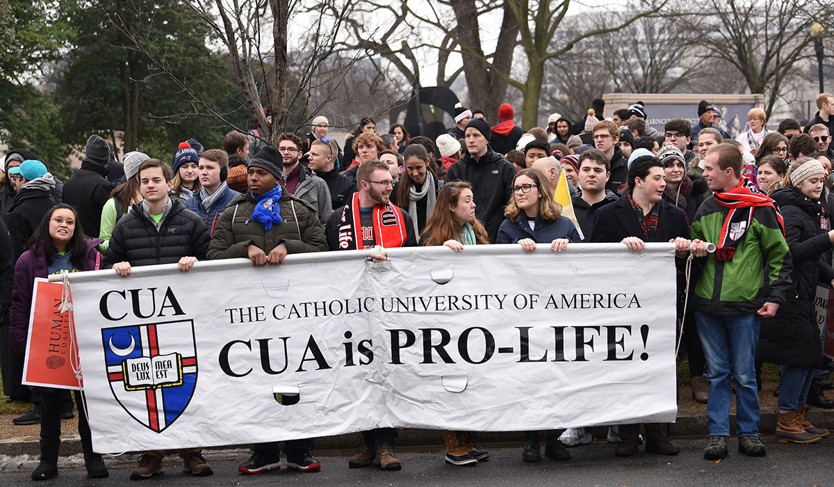 Students carrying Catholic University pro-life banner