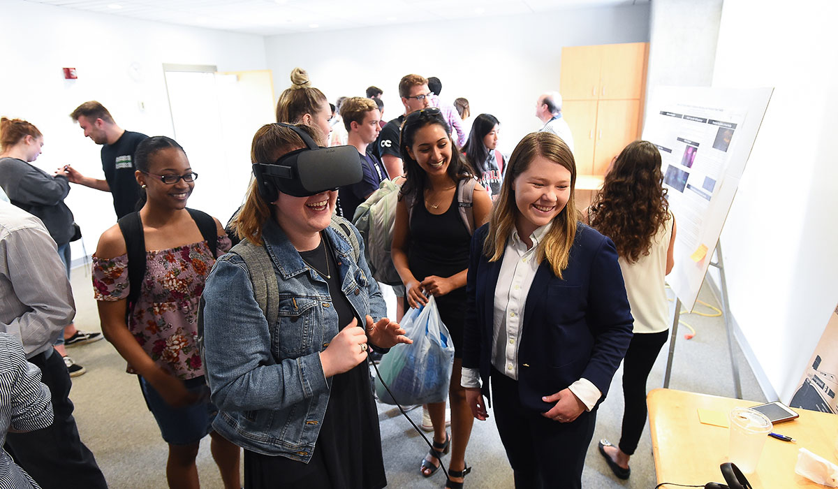 Students wearing a virtual reality headset at Research Day 2019