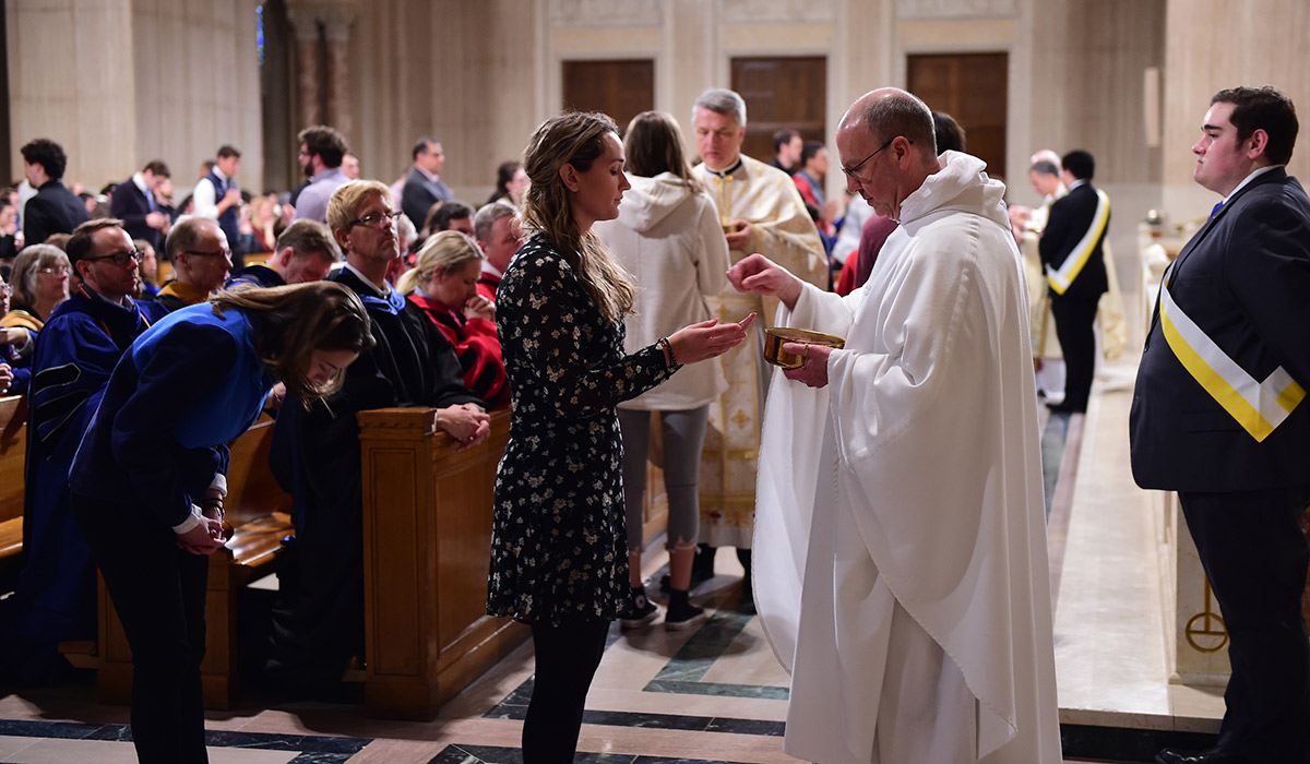 Student receiving communion