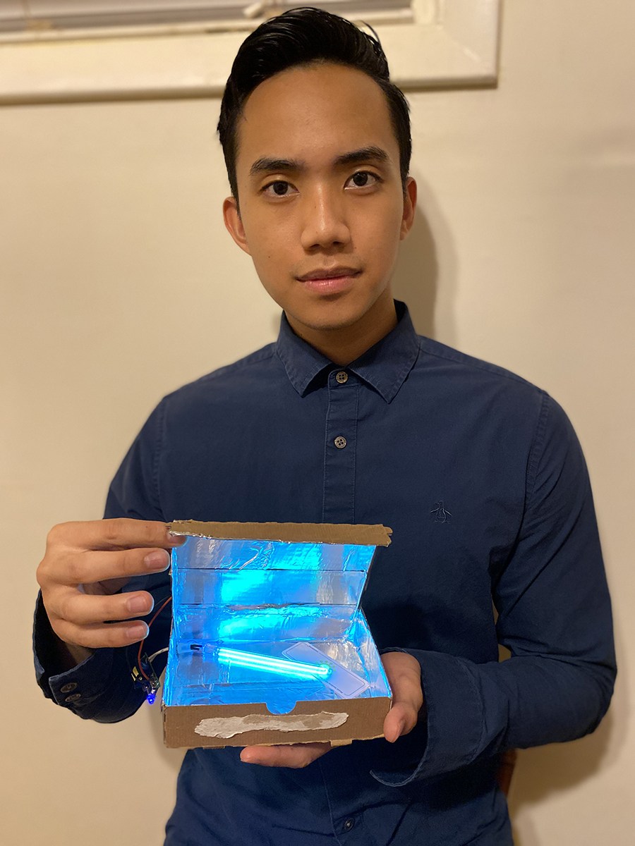 Marshall Mendoza displays his design project, the “De-Coronizer 7000,” a portable box which cleans face masks using a UV light. 