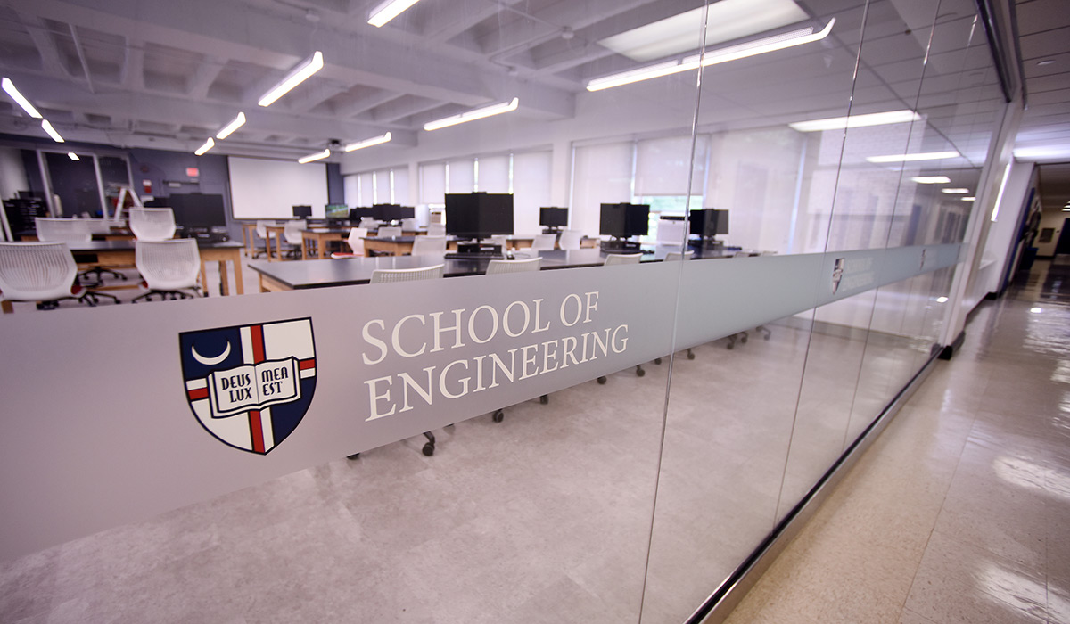 Sign for School of Engineering on glass doors