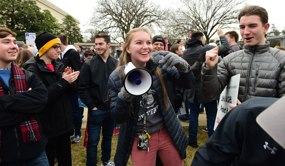 Female student with a megaphone