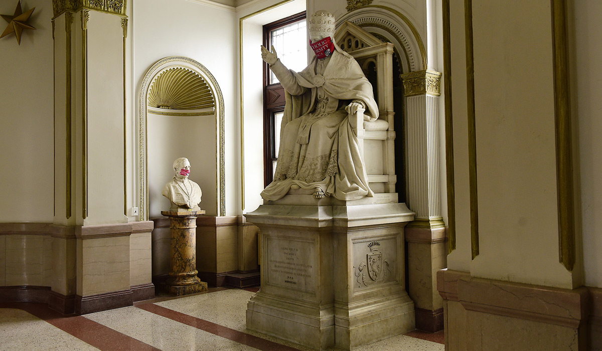 Statues in McMahon Hall with masks on