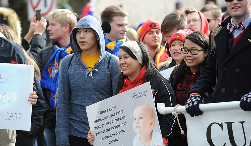 Washington Monument with tree with red leaves