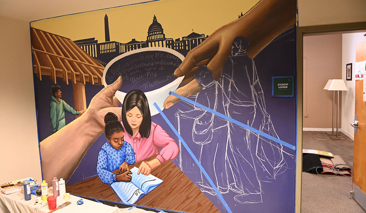 Progression of the mural with paintings of people and more chalk lines