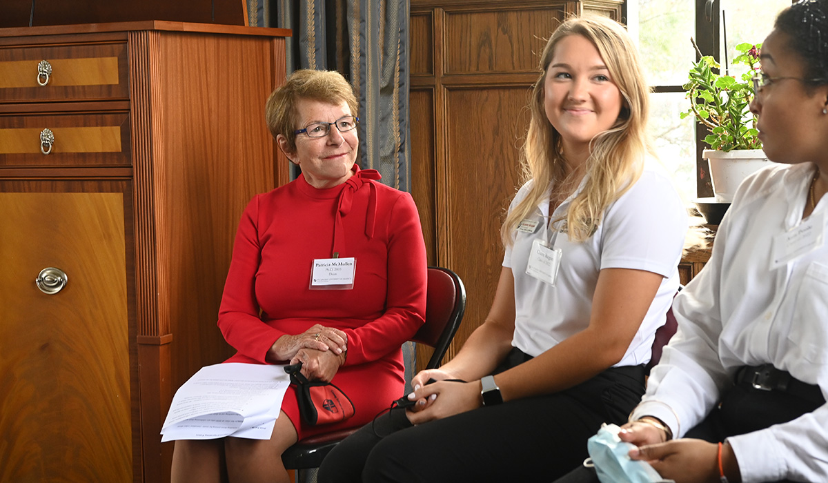 Dean McMullen speaks with students