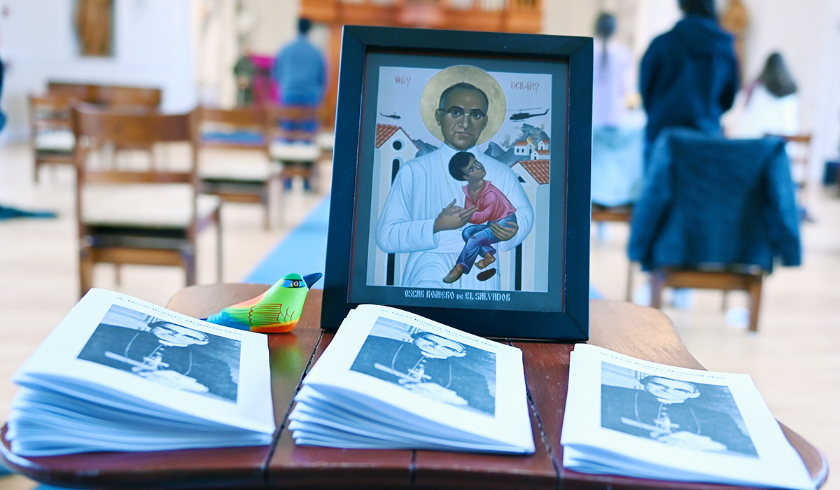 Programs depicting Oscar Romero with Mass going on in background