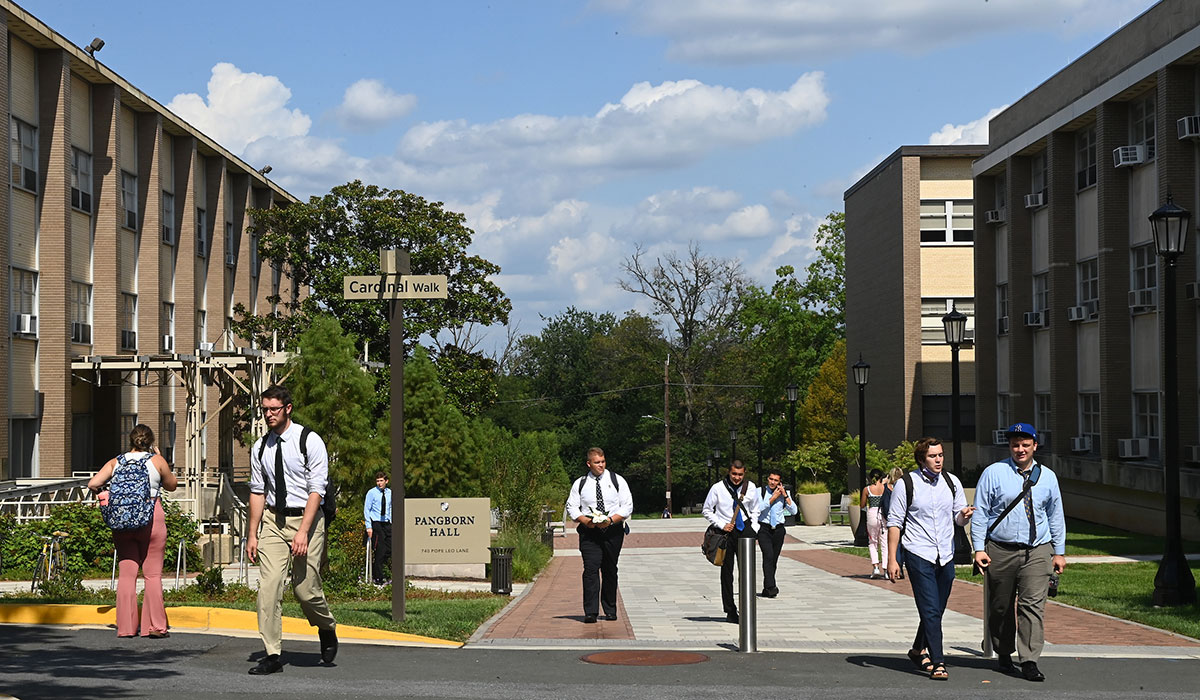 Students near entrance to campus