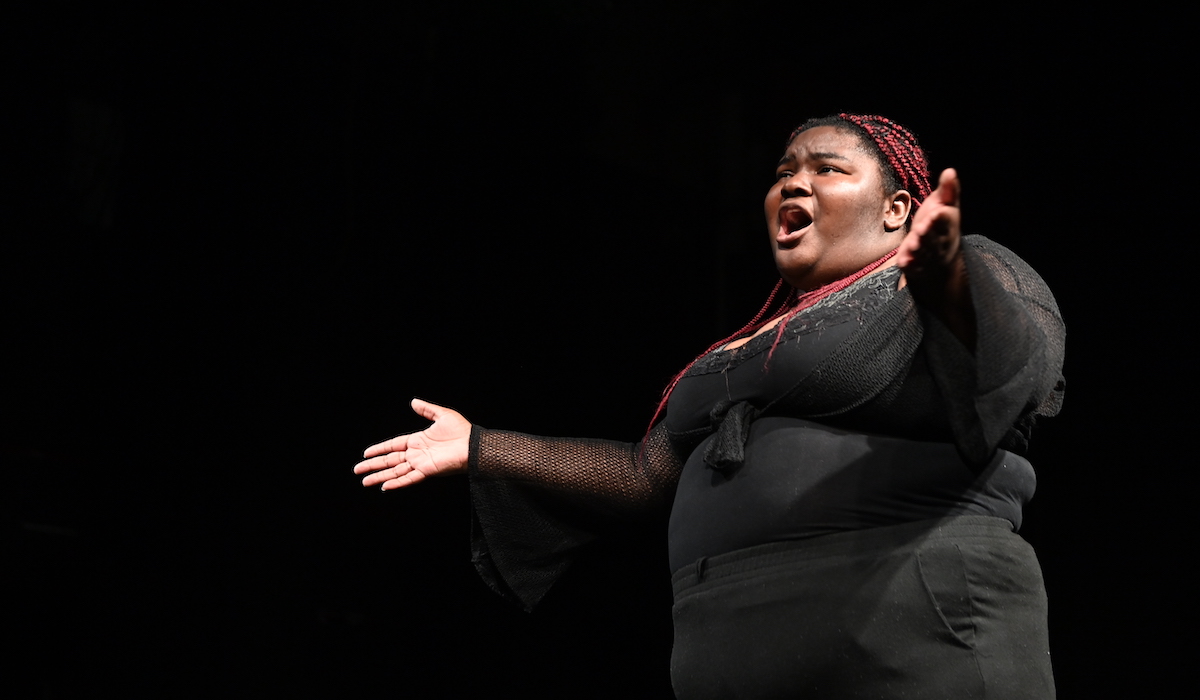 A female student performs on stage during the final dress rehearsal of the summer high school drama institute