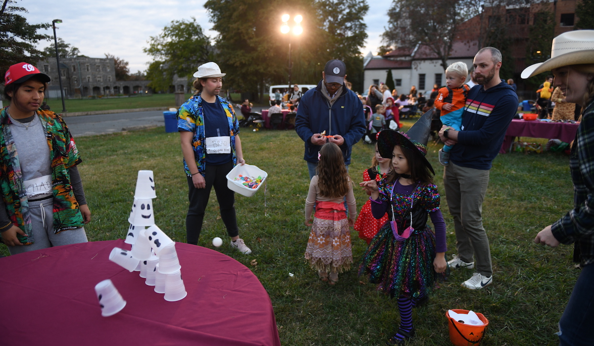 students and families play a game at Halloween on Campus