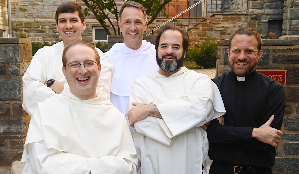 all five campus ministry chaplains pose for a picture together on campus