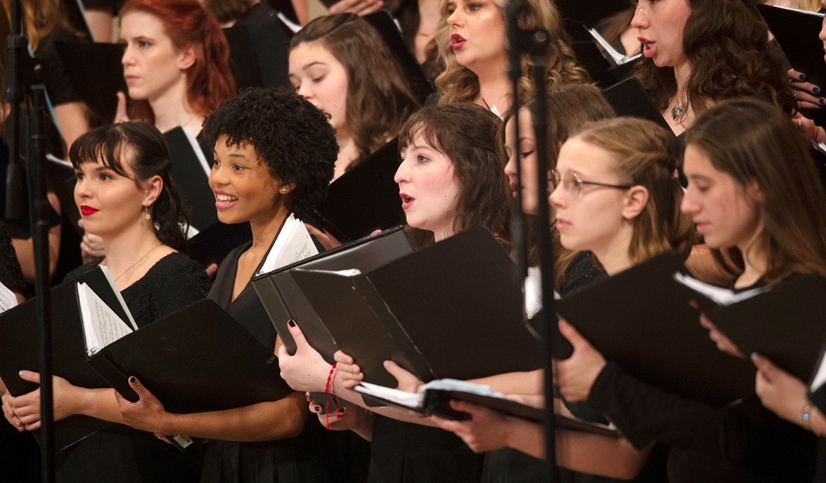 Women in the University's choir singing at the concert