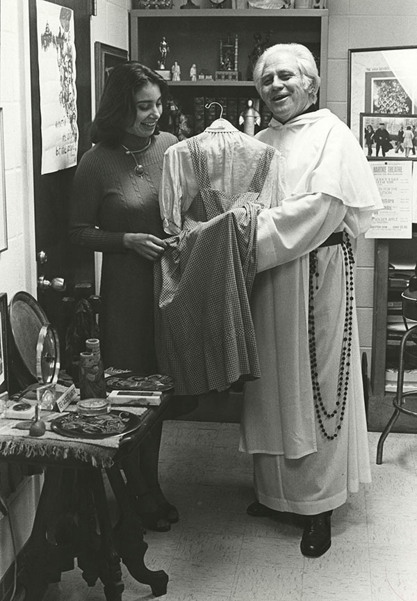 Rev. Gilbert Hartke with the dress