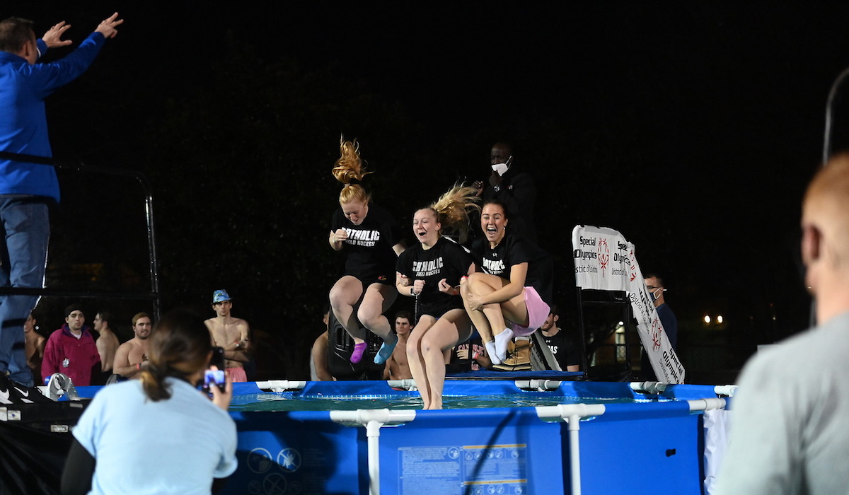 Three girls cannonball into the Polar Plunge pool