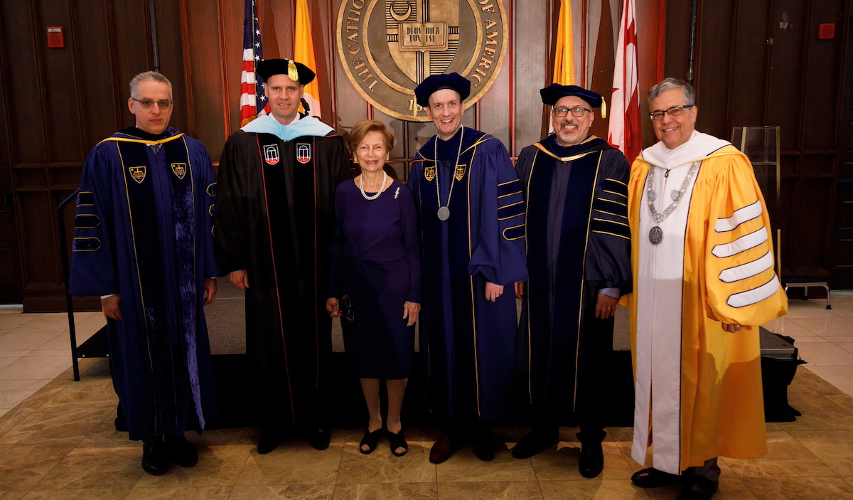 Dr. Elliot alongside University faculty and administration staff