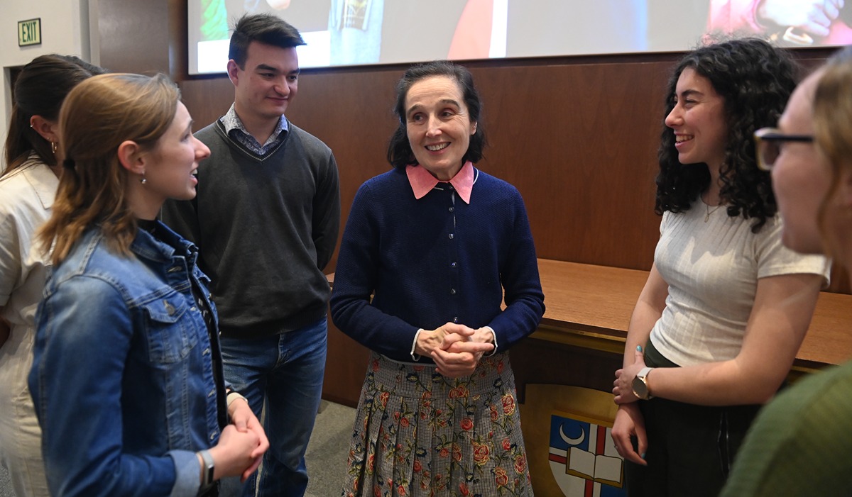 Dr. Gianna Molla speaks with students following her April 25 talk at The Catholic University of America.