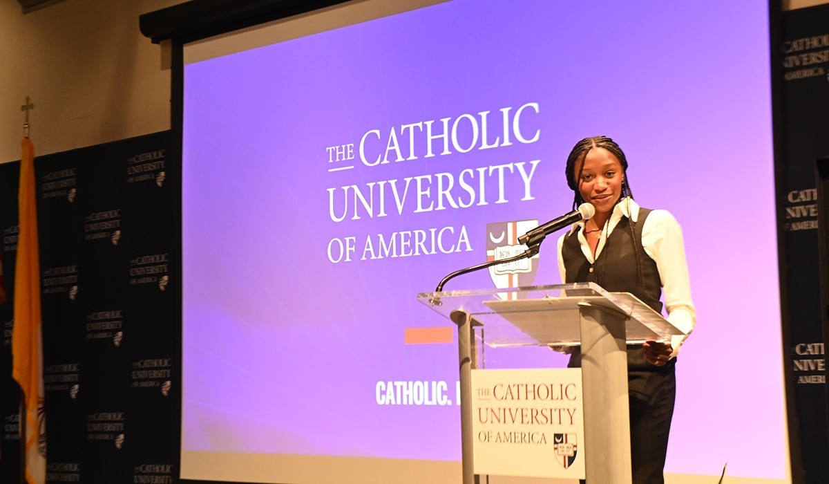 Orientation student coordinator Anisa Ellis, a nursing senior, speaks to the crowd of first-year students