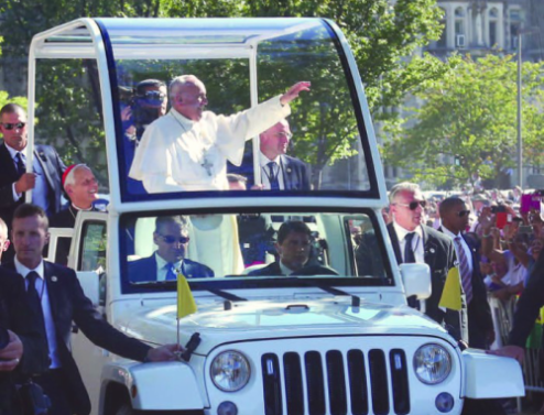 Pope Francis in the popemobile in front of Gibbons Hall
