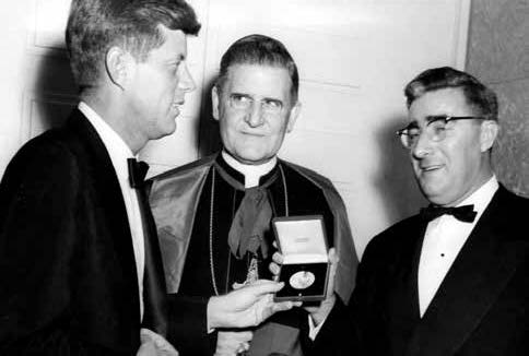 Senator Kennedy receiving his Gibbons medal