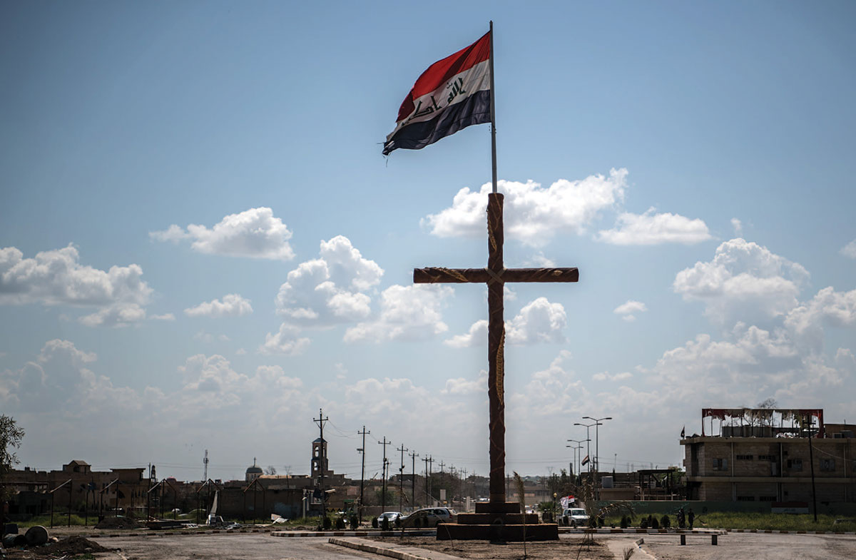 A cross with an Iraqi flag on top