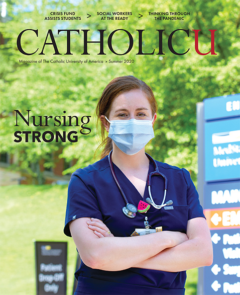 Cover of CatholicU Magazine showing a female nurse in front of her hospital wearing scrubs and a mask