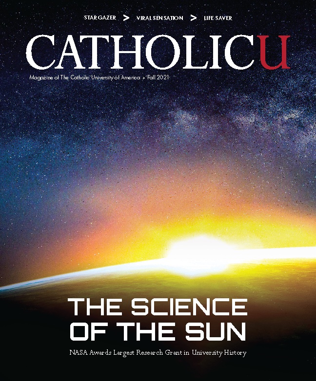 Cover of CatholicU Magazine showing the sun rise on earth's surface from space