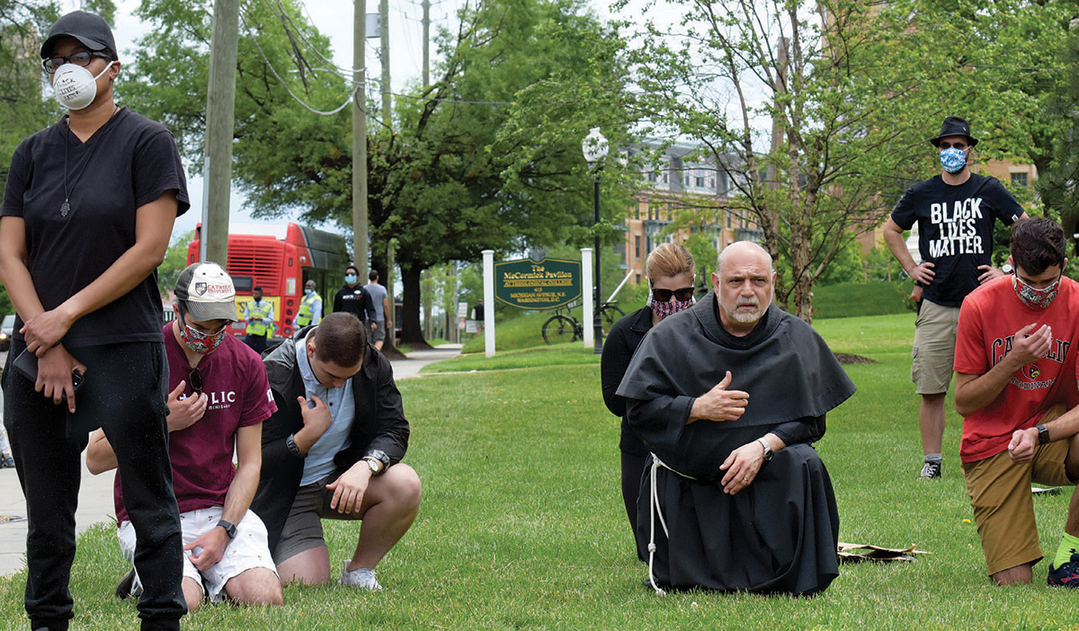 University Chaplain and Director of Campus Ministry Father Jude DeAngelo, O.F.M. Conv., protests through prayer while President Trump’s motorcade passes by on the way to the St. John Paul II Shrine next to campus on June 2. 