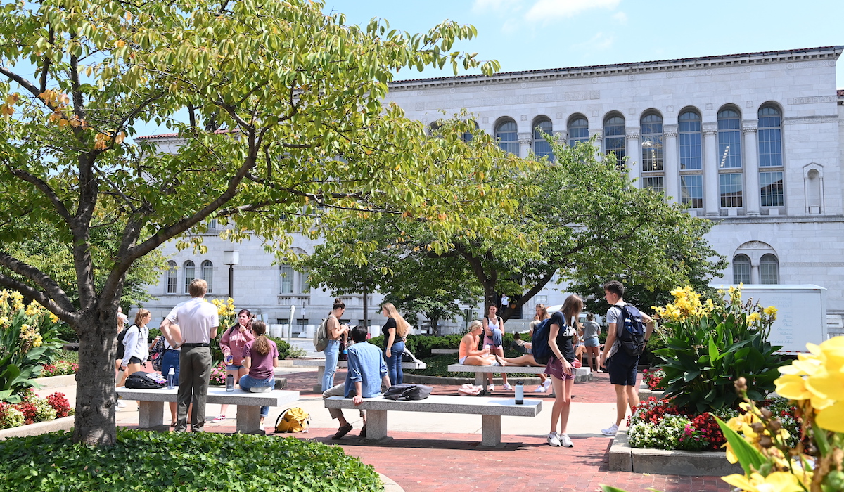 Students outside on a plaza on the first day of school