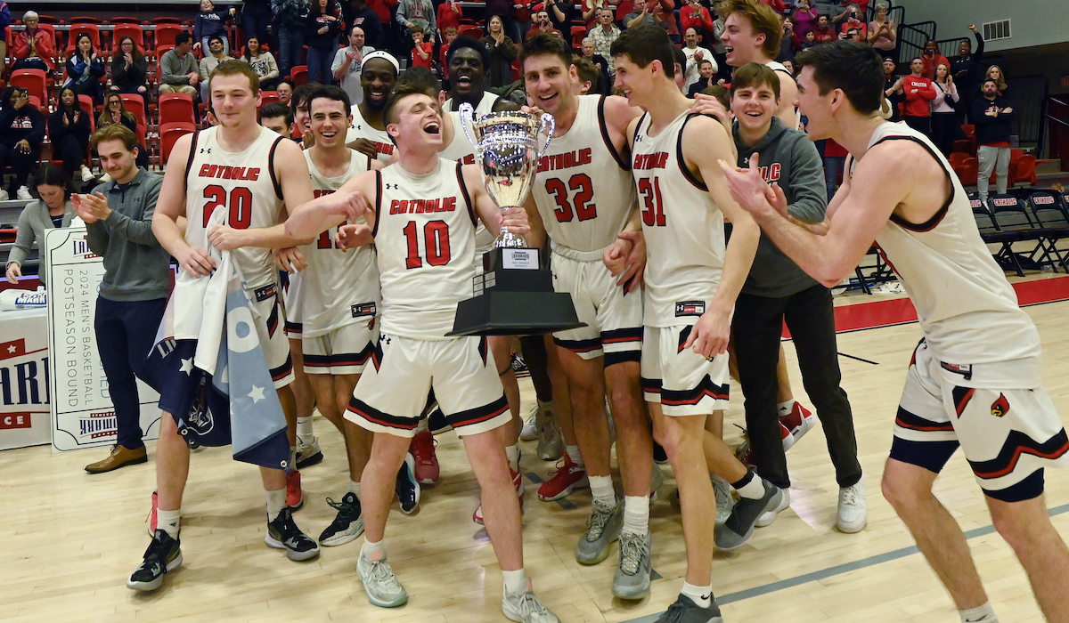 men's basketball team celebrating