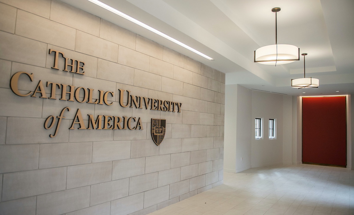 The Catholic University of America sign on the wall of the lobby in Fr. O'Connell Hall